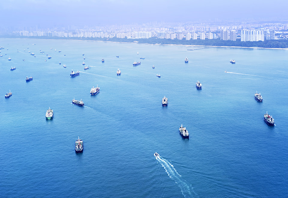 Image of ships waiting in a canal to enter a port