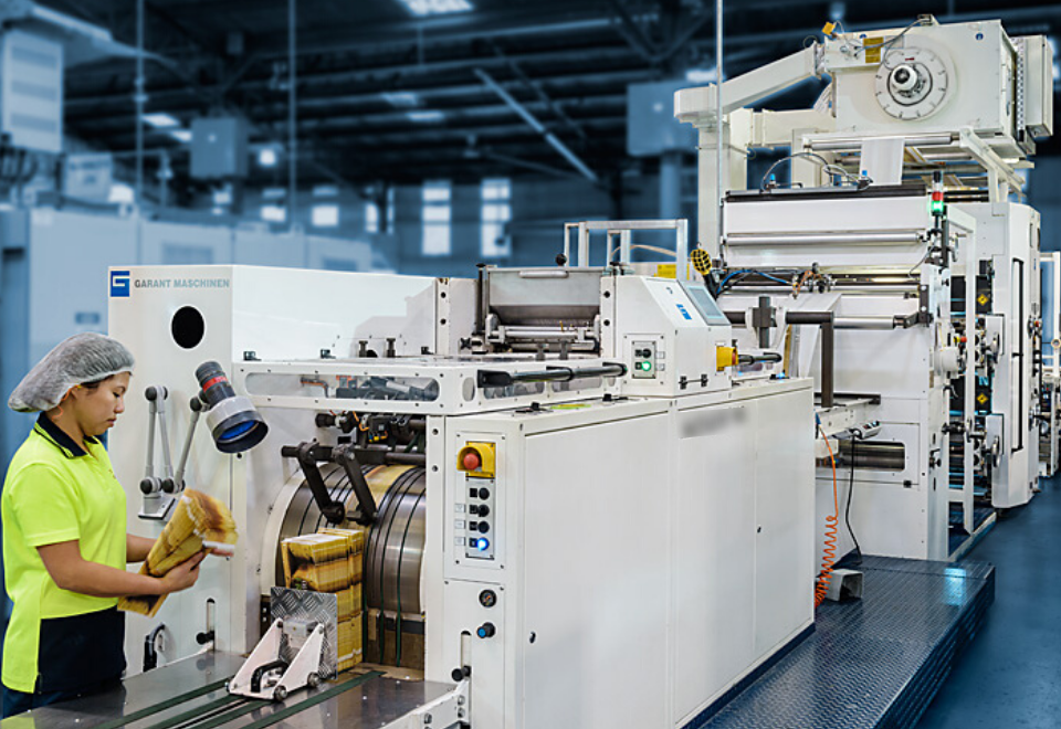 Image of woman manufacturing paper bags